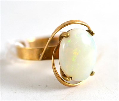 Lot 210 - An opal ring stamped '9ct'