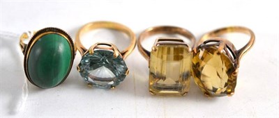 Lot 211 - A synthetic spinel ring, a malachite ring stamped '9ct', two citrine rings and a blue stone...