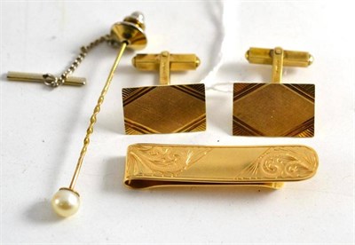 Lot 215 - A pearl stick pin, a tie clip stamped '18ct' and a pair of 9ct gold cufflinks