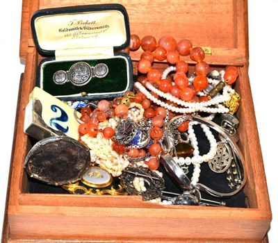 Lot 225 - A collection of costume jewellery including a silver bangle, assorted brooches etc