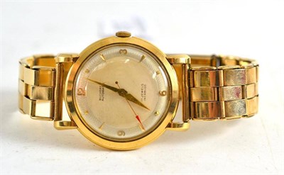 Lot 237 - An 18ct gold wristwatch, retailed by Bucherer, with box, bracelet clasp stamped 9ct metal core