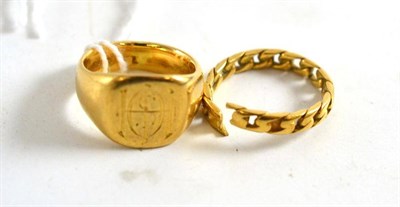 Lot 255 - A damaged 18ct gold bang ring and a signet ring