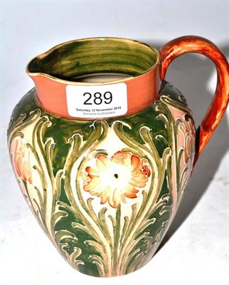 Lot 289 - William Moorcroft Macintyre jug, glazed in salmon and green, printed and impressed marks, 16cm