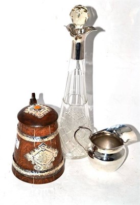 Lot 290 - A Latvian oak tankard with silver and amber mounts, a WMF cream jug and a claret jug