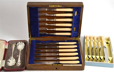 Lot 296 - A pair of cased silver fruit spoons, tea knives and an oak cased set of dessert eaters