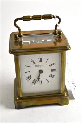 Lot 302 - A brass cased carriage clock in a leather fitted case