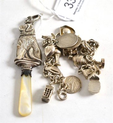 Lot 333 - Silver charm bracelet and childs rattle and teether modelled as a dog (2)