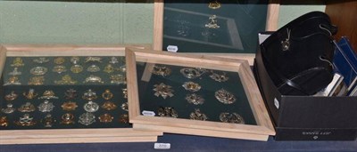 Lot 370 - A collection of military cap badges in three cases, Harrogate postcards, coins etc