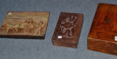 Lot 387 - Carved oak hinged box, brass bound writing slope and carved plaque of a cart-horse (3)