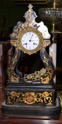 Lot 401 - An ebonised and brass inlaid portico mantel clock