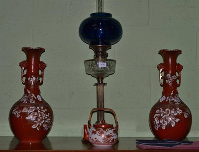 Lot 406 - A brass oil lamp with clear glass reservoir, two satsuma vases and a Kutani teapot