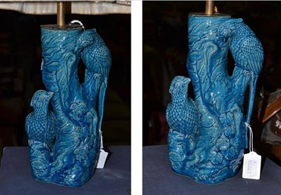 Lot 410 - A pair of turquoise glaze pottery table lamps decorated with birds