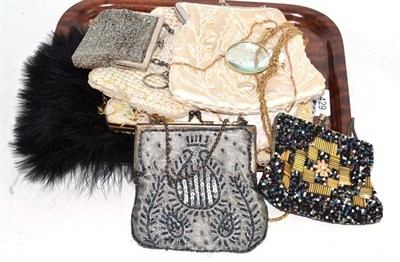 Lot 429 - Two lorgnettes, black ostrich feather fan, seven assorted bead and sequin evening purses