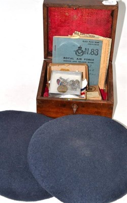 Lot 436 - Mahogany box with group of Second World War medals and two caps, one with RAF badge