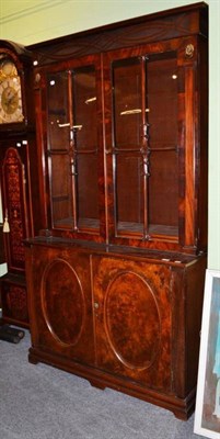 Lot 556 - A George IV mahogany and rosewood crossbanded bookcase