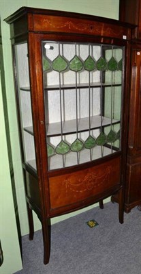 Lot 560 - An Edwardian inlaid mahogany display cabinet with stained glass door