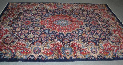 Lot 562 - Kashmir carpet, Khorarsan, the indigo field of palmettes and vines around a pole medallion...