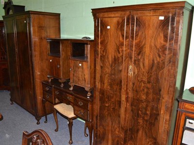 Lot 565 - Walnut six piece bedroom suite comprising a pair of double wardrobes, dressing table, pair of...