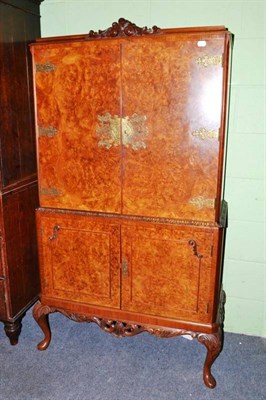 Lot 568 - Burr walnut drinks cabinet