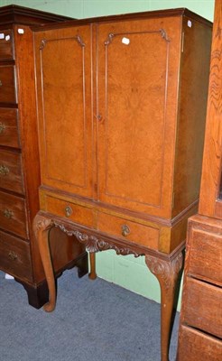 Lot 570 - Walnut drinks cabinet