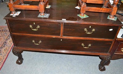 Lot 588 - Mahogany commode chest of two short and one long drawer, on heavily carved claw and ball feet