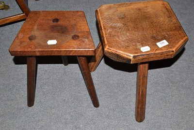 Lot 596 - An oak milking stool and another smaller