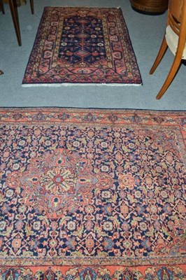 Lot 598 - A modern blue and red ground Eastern patterned rug and another similar (2)