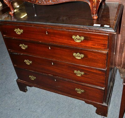 Lot 603 - A George IV mahogany four height chest of drawers with glass top