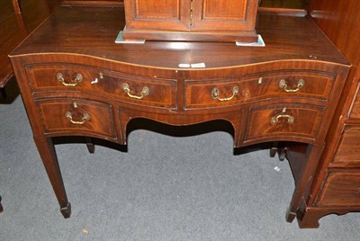 Lot 608 - Mahogany inlaid serpentine front dressing table