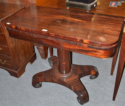 Lot 613 - A 19th century rosewood fold-over tea table