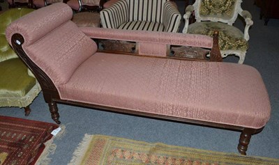 Lot 636 - A Victorian and mahogany framed chaise longue with pink trellis patterned upholstery