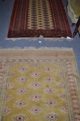 Lot 639 - A Bukhara rug, Lahore, Punjab, the field of quartered guls enclosed by rust borders of sunburst...