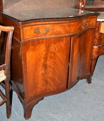 Lot 685 - A reproduction mahogany serpentine cabinet