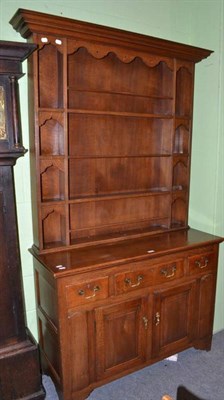 Lot 698 - An oak dresser with rack, together with a copy of the original receipt dated June 9th 1915 for...