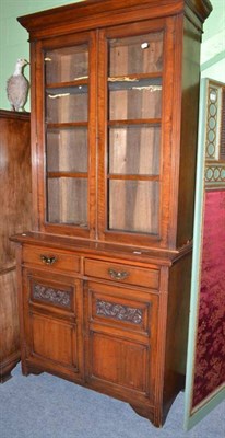 Lot 702 - A late Victorian carved walnut bureau bookcase