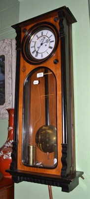 Lot 723 - A walnut and ebonised Vienna wall clock