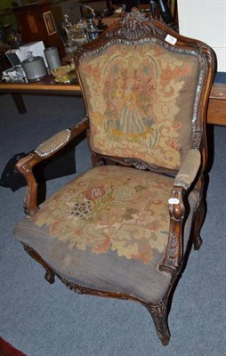 Lot 734 - A carved walnut framed open armchair with a woolwork and petit point seat and back