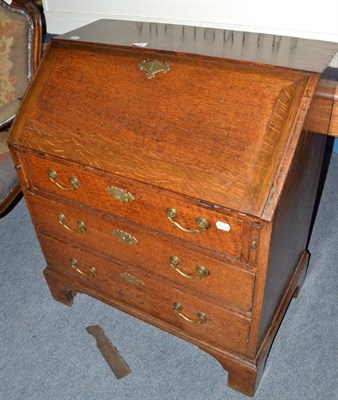 Lot 735 - A Georgian oak bureau of small proportions