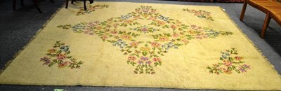 Lot 747 - An Indian carpet, the cream field with a floral medallion framed by spandrels, 312cm by 276cm