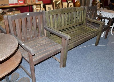 Lot 821 - A garden bench and a pair of chairs