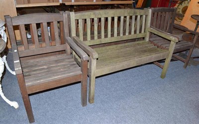 Lot 827 - A garden bench and a pair of chairs