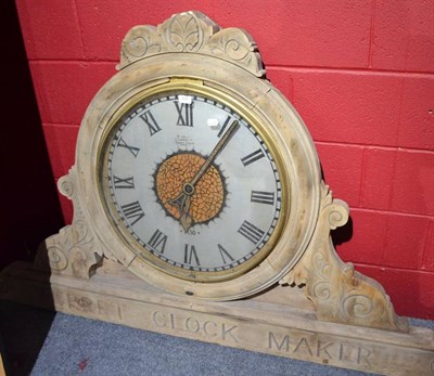 Lot 828 - A large dial and movement, dial inscribed J.Kelly, Liverpool, case carved ";turret clock maker"