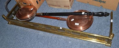 Lot 884 - Two copper warming pans and a Victorian pierced brass fender