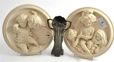 Lot 6 - A WMF Art Nouveau pewter vase and a pair of reproduction plaques