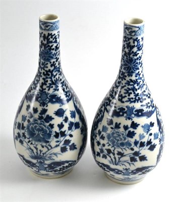 Lot 21 - A pair of Chinese blue and white porcelain bottle vases