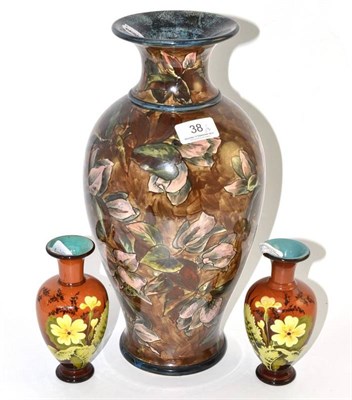 Lot 38 - A Doulton Lambeth faience vase, dated 1877, together with a similar smaller pair (3)