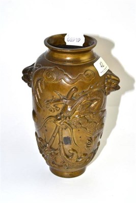 Lot 42 - A Chinese bronze vase, decorated with two five claw dragons and mask handles