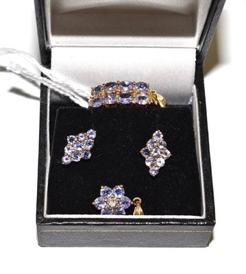 Lot 64 - A 14ct gold tanzanite two row ring, a pair of cluster earrings and a 9ct gold diamond and tanzanite