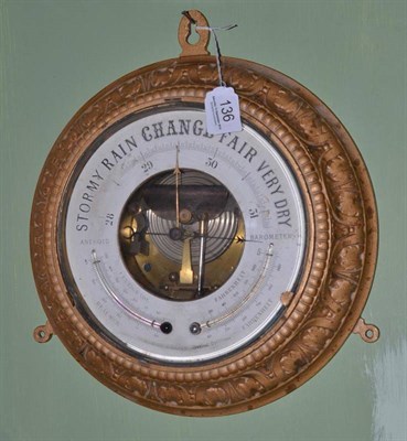 Lot 136 - An aneroid barometer signed 'Whitfield & Hakes'