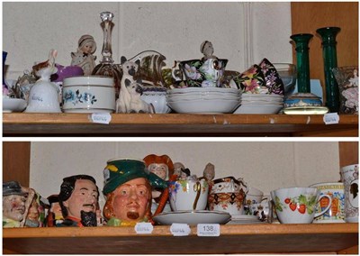 Lot 138 - Two shelves of decorative ceramics including Doulton and other character jugs, commemorative...